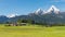 Traditional Alpine spring panoramic landscape in Berchtesgaden with Watzmann mount and flowering meadow