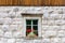 Traditional alpine stone window.