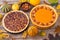 Traditional American autumn dessert . Pumpkin and pecan pie