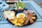 Traditional American breakfast - fried egg, bacon, ham, sausage, toast, salad