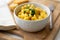 Traditional American macaroni and cheese comfort food also called mac n cheese with elbow pasta coated in a cheesy creamy cheddar