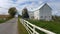 A traditional Amish barn and a white picket fence in Ohio, USA