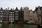 Traditional Amsterdam buildings on a canal, canal-side houses on water