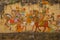 Traditional ancient stile indian wall painting on the old plastered wall in Udaipur, India