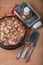 Traditional apple pie sugary dessert with candle and old books