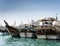 Traditional arabian dhow boats in deira harbour of dubai UAE