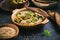 Traditional arabian eggplant dip (baba ganoush) on rustic dark table