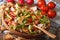 Traditional Arabic fattoush salad close-up on a plate. horizontal