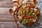 Traditional Arabic fattoush salad on a plate. Horizontal top vie