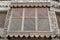 Traditional Arabic mashrabiya balcony enclosed with carved wood latticework