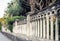 Traditional architecture of Catania,  baroque pillars - fragment of historical fence of Giardino Bellini, famous public garden