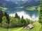 Traditional architecture and farmhouse in the valley of Wagital or Waegital and by the alpine Lake Wagitalersee Waegitalersee