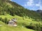 Traditional architecture and farmhouse in the valley of Wagital or Waegital and by the alpine Lake Wagitalersee Waegitalersee