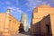 Traditional architecture inside Khiva old town with The Kalta Minor Minaret in the background, Khiva