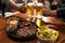 Traditional Argentinian barbecued meat and salad with people drinking beer in the background