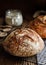 Traditional artisan sourdough bread on a cooling tray