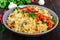 A traditional Asian dish - pilaf with meat, mushrooms and pepper capi in a bowl