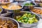 Traditional Asian dishes sold in a food court in Singapore