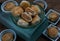 A traditional asian pastry or Tao Sor in vintage green glass bowl. Chinese sweet pastry filled with mung bean paste, taro, and