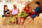 Traditional Asian Thai rural daily life, grandchildren in cultural costumes help their seniors preparing local food ingredients