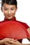 Traditional asian woman holding a red beautiful fan