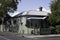 Traditional Australian wooden colonial residential house with wrought iron porch posts and railings