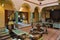 Traditional authentic Moroccan riad interior with sitting and dining area