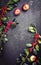 Traditional Autumn frame decoration with apples and branch berries with copy space in the middle on a rusty metal