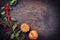 Traditional Autumn frame decoration with pumpkin and branch with berries with copy space right on a rusty metal sheet