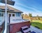 Traditional back deck with tall windows, and jacuzzi tub.