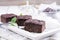 Traditional baked American brownies in a shabby chic wooden tray