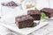 Traditional baked American brownies in a shabby chic wooden tray