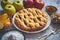 Traditional baked apple pie cake served on ceramic plate