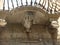 Traditional  balcony of Ragusa Ibla with under a statue in  Sicily, Italy.