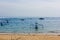 Traditional Balinese fishing boat in the sandy bay at anchor.