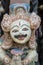 Traditional Balinese stone statuette of the deity in the street temple. Island Bali, Indonesia . Closeup