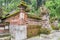 Traditional Balinese temple in a forest at a side of rice terrace plantation, Ubud Bali