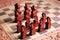 Traditional Balinese wooden chess pieces on wood carved chess board