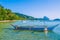 Traditional banca boat in clear water at sandy Corong Beach in El Nido, Philippines