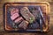 Traditional barbecue dry aged angus roast beef on a wooden cutting board