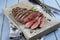 Traditional barbecue dry aged angus sirloin beef steak on a design stone tray