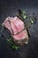 Traditional barbecue dry aged wagyu chateaubriand beef steak offered spice and herbs on a rustic metal board