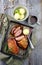 Traditional barbecue gourmet duck breast filet with skin with potato dumplings in dark beer sauce on a rustic metal tray