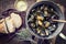 Traditional barbecue Italian blue mussel with farmhouse bread and white wine in a casserole