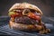 Traditional barbecue wagyu cheeseburger with onions and tomatoes on a rustic grillage