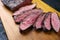 Traditional barbecue wagyu gourmet bavette steak on a wooden design board