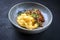 Traditional barbecue wagyu pulled beef with Italian polenta and herbs on a Nordic design bowl