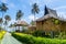 Traditional beach bungalows and coconut palms on Koh Phi Phi isl