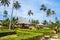 Traditional beach bungalows and coconut palms on Koh Phi Phi isl