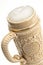 Traditional beer mug with froth over white